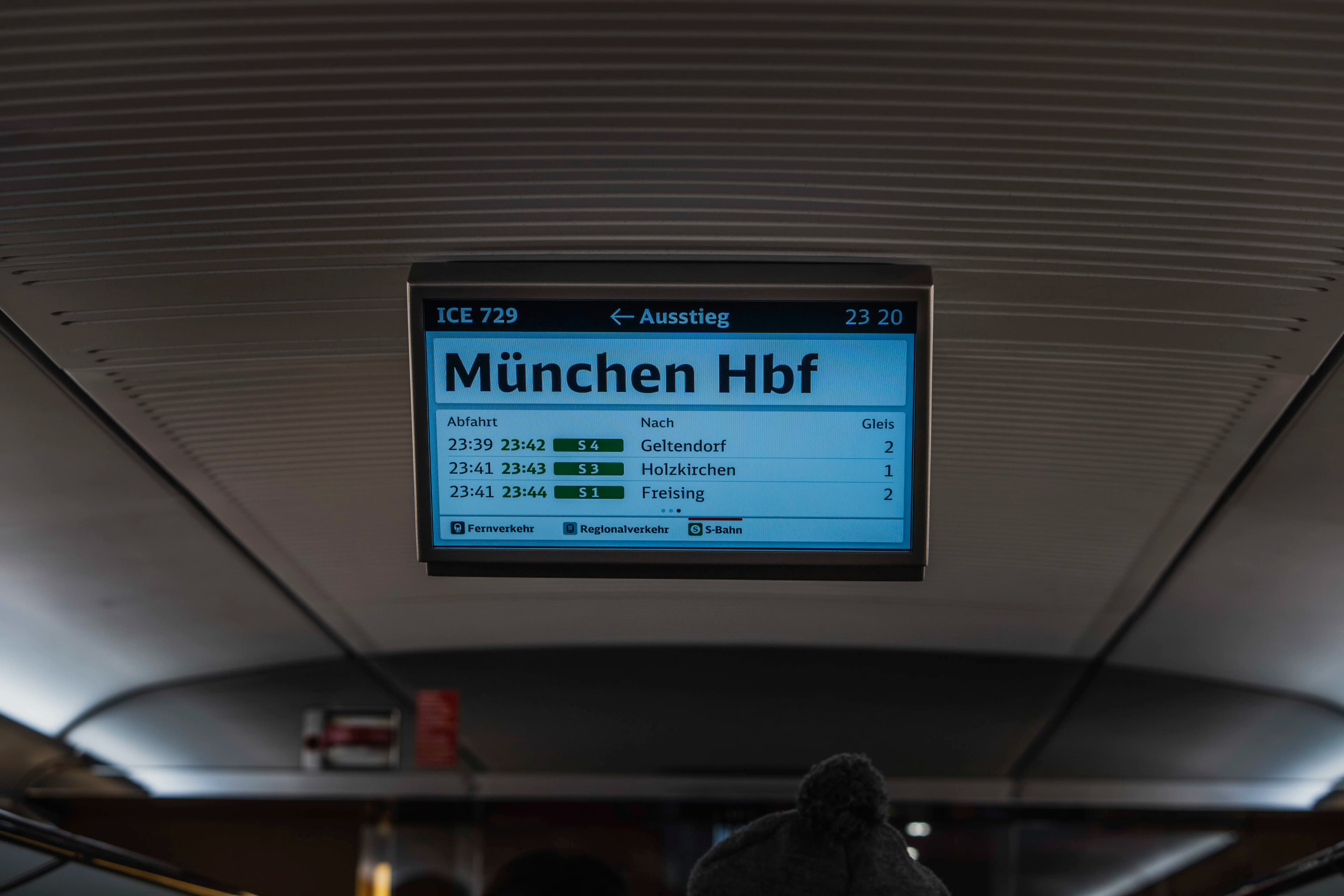 a sign that is on the ceiling of a train