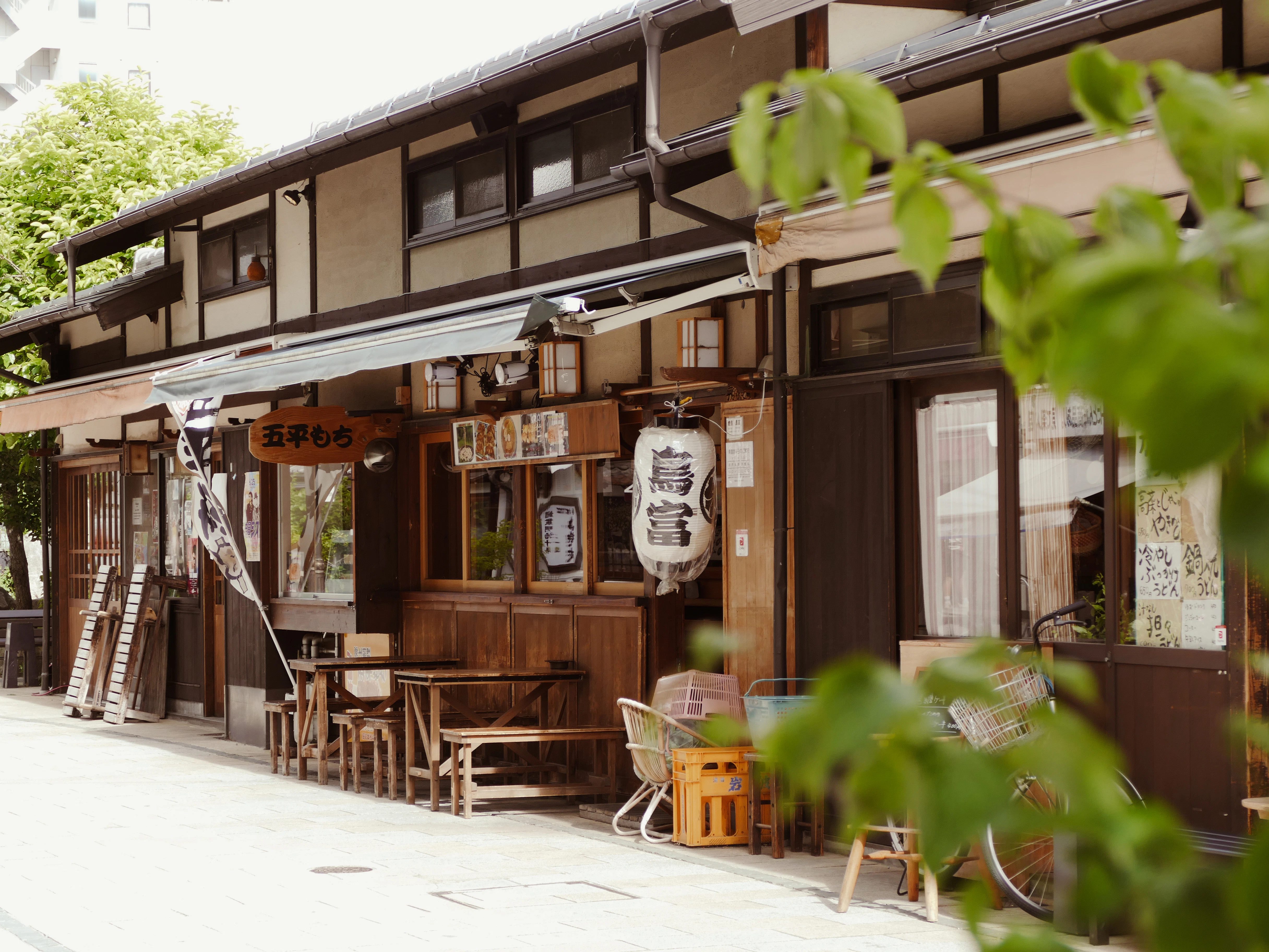 Japanese shopfront with outdoor seating.