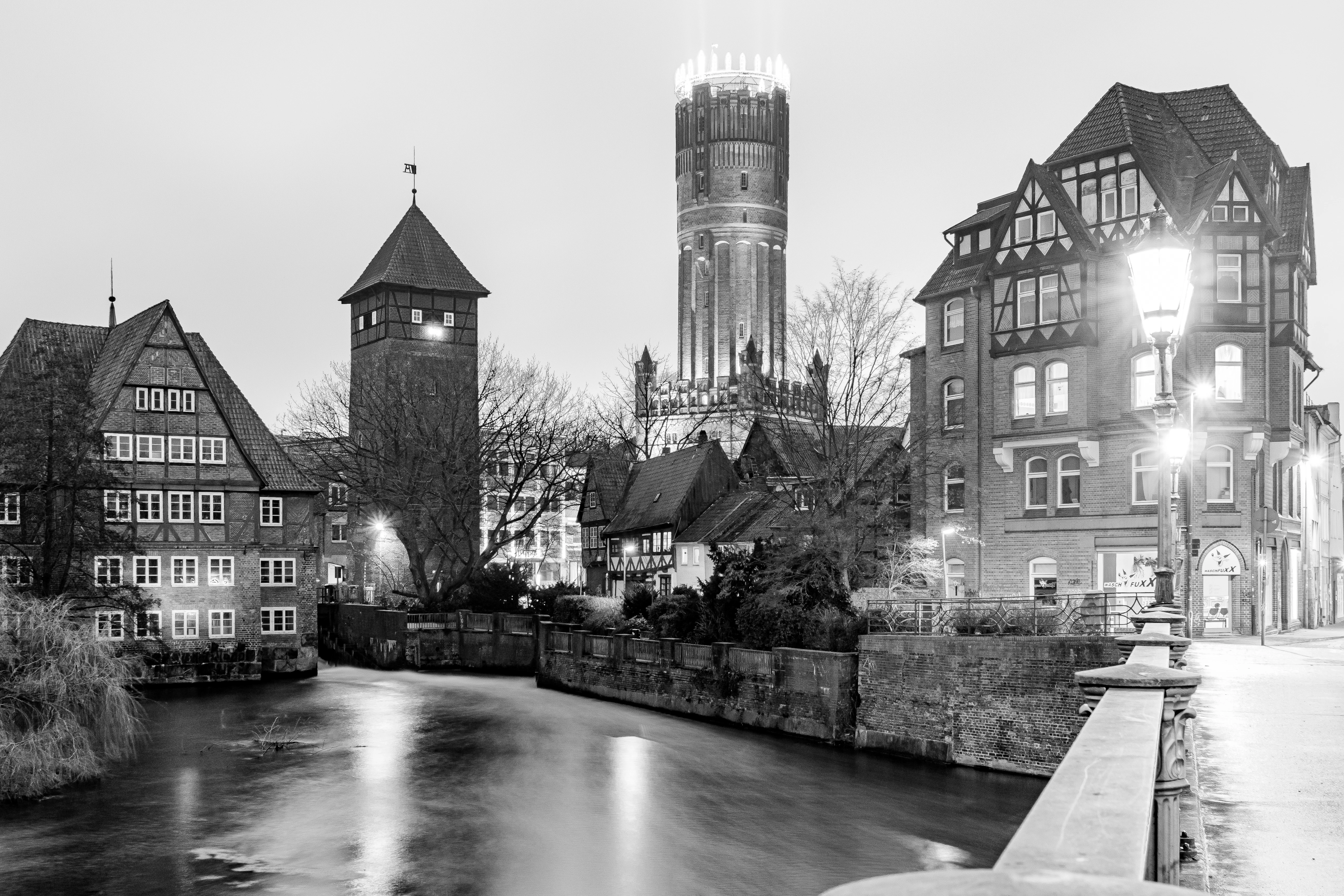 A black and white photo of a city at night