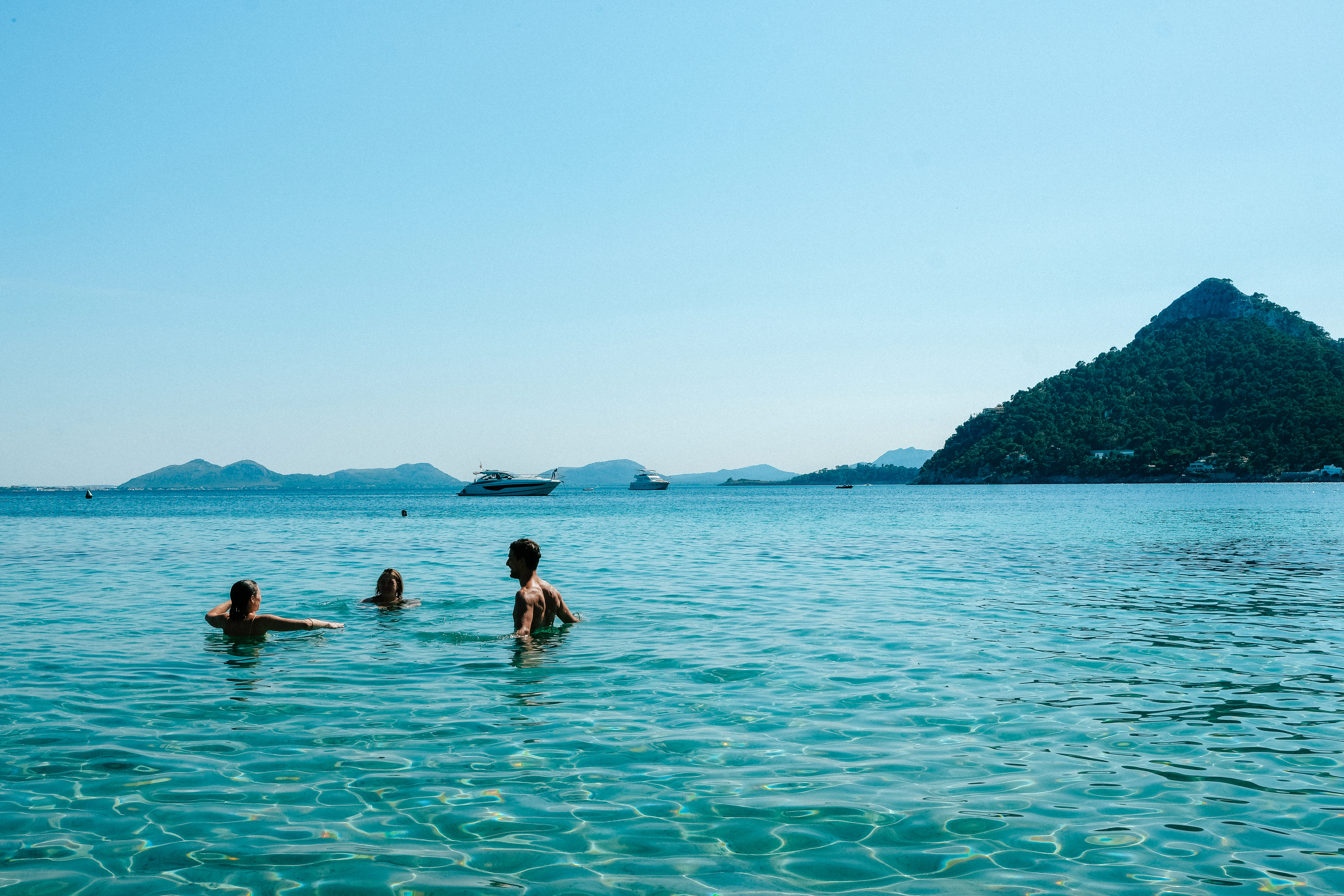 a group of people swimming in a large body of water