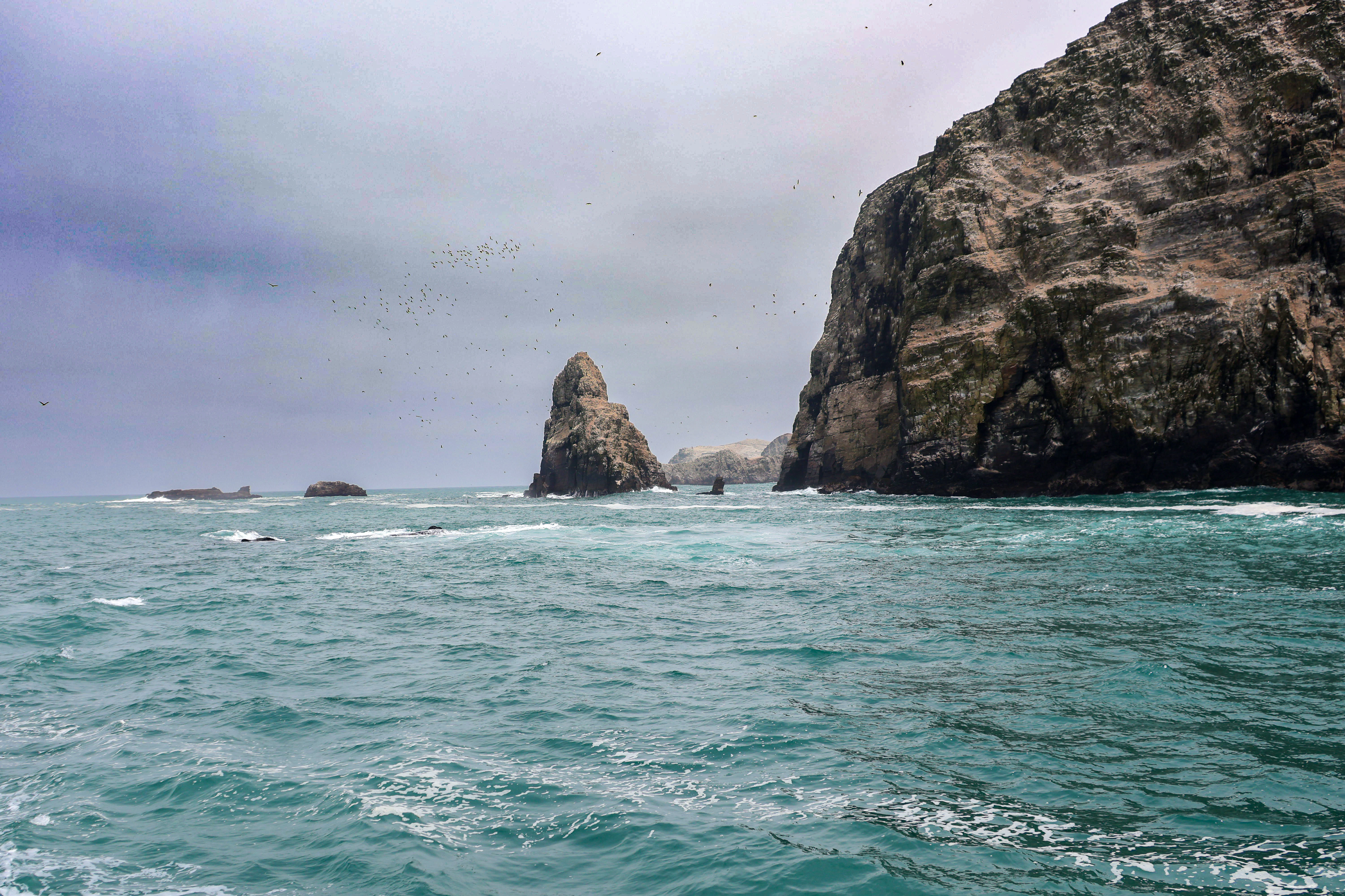 A rock outcropping in the middle of the ocean
