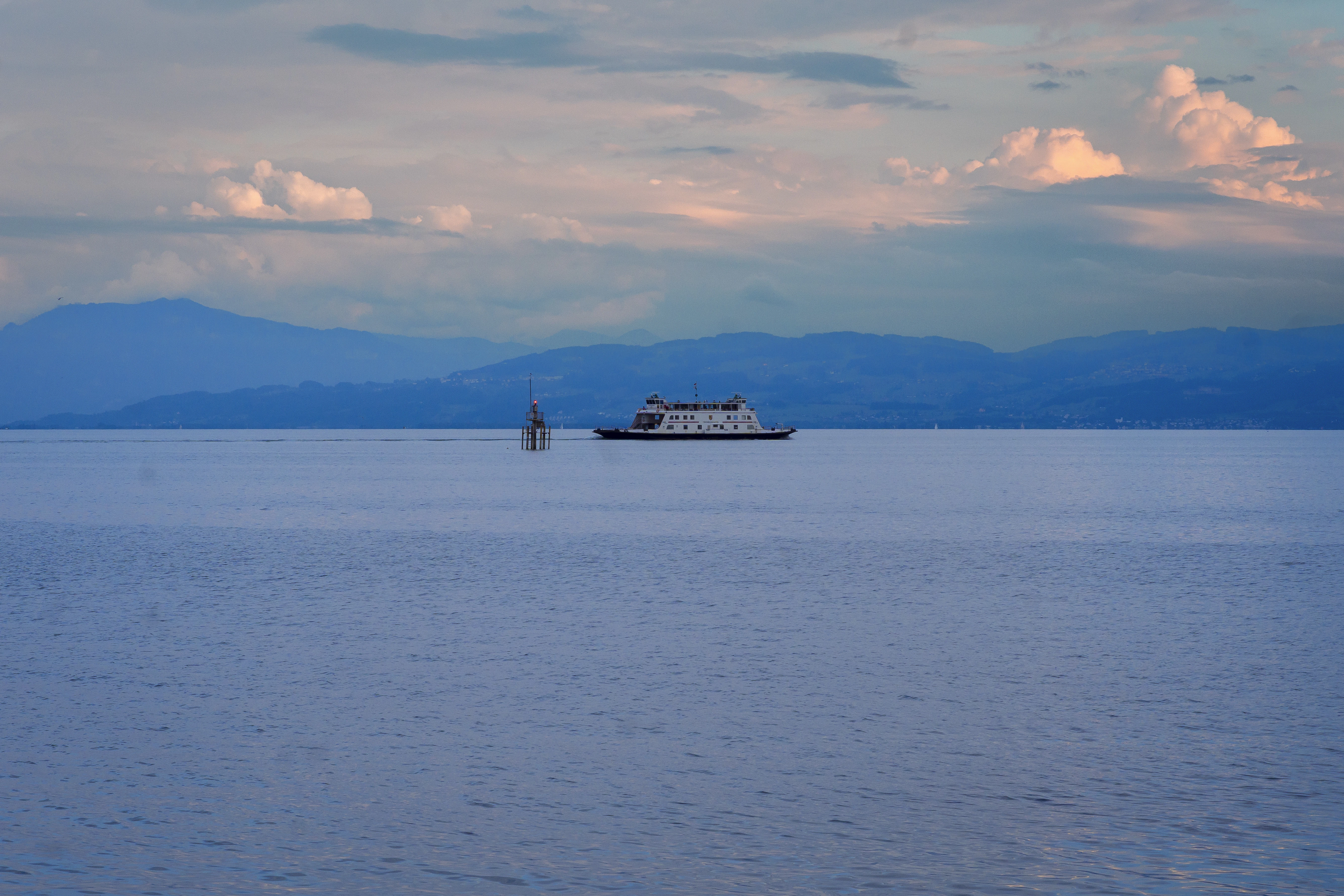 A large boat floating on top of a large body of water