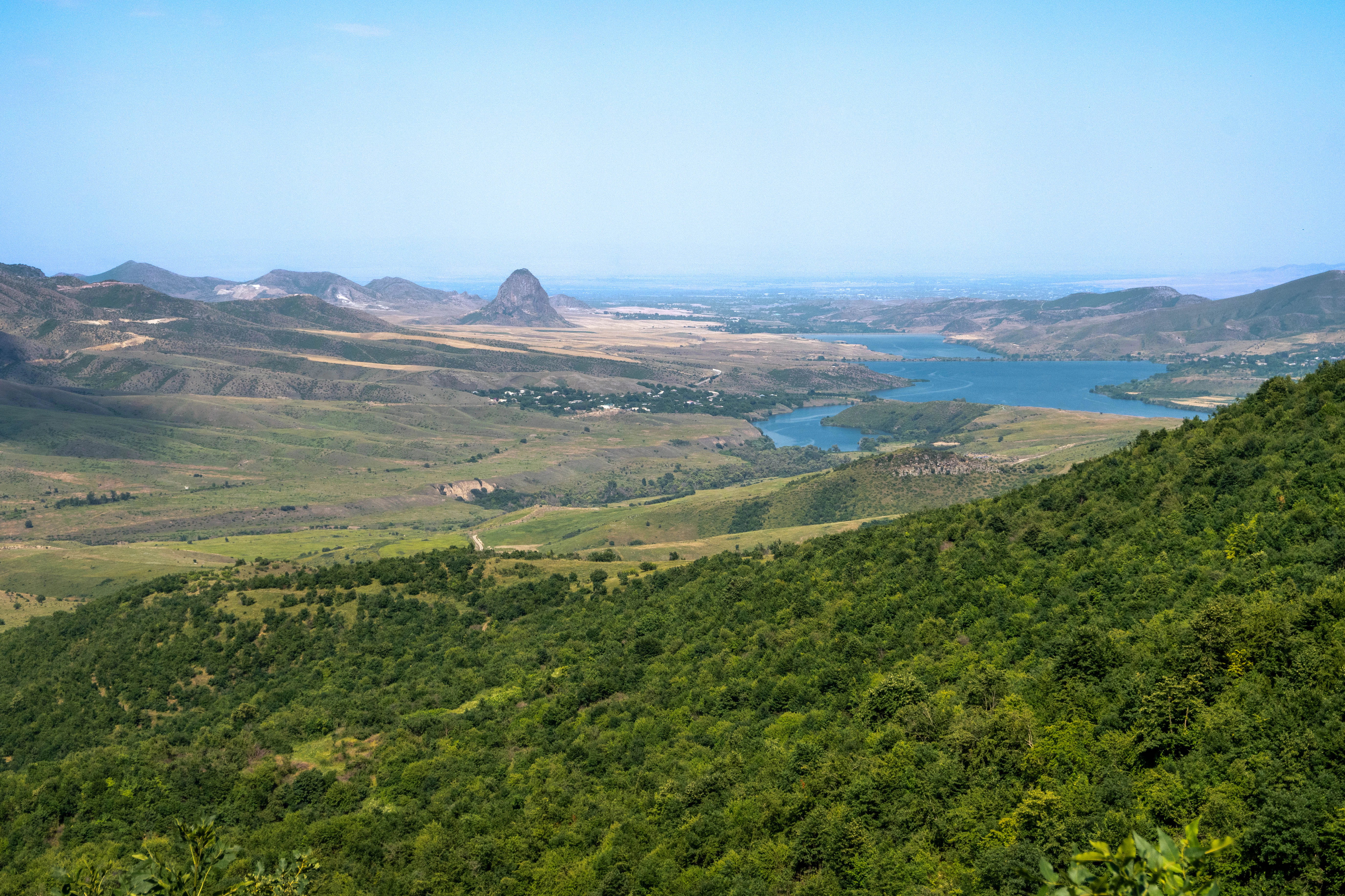 a landscape with trees and hills