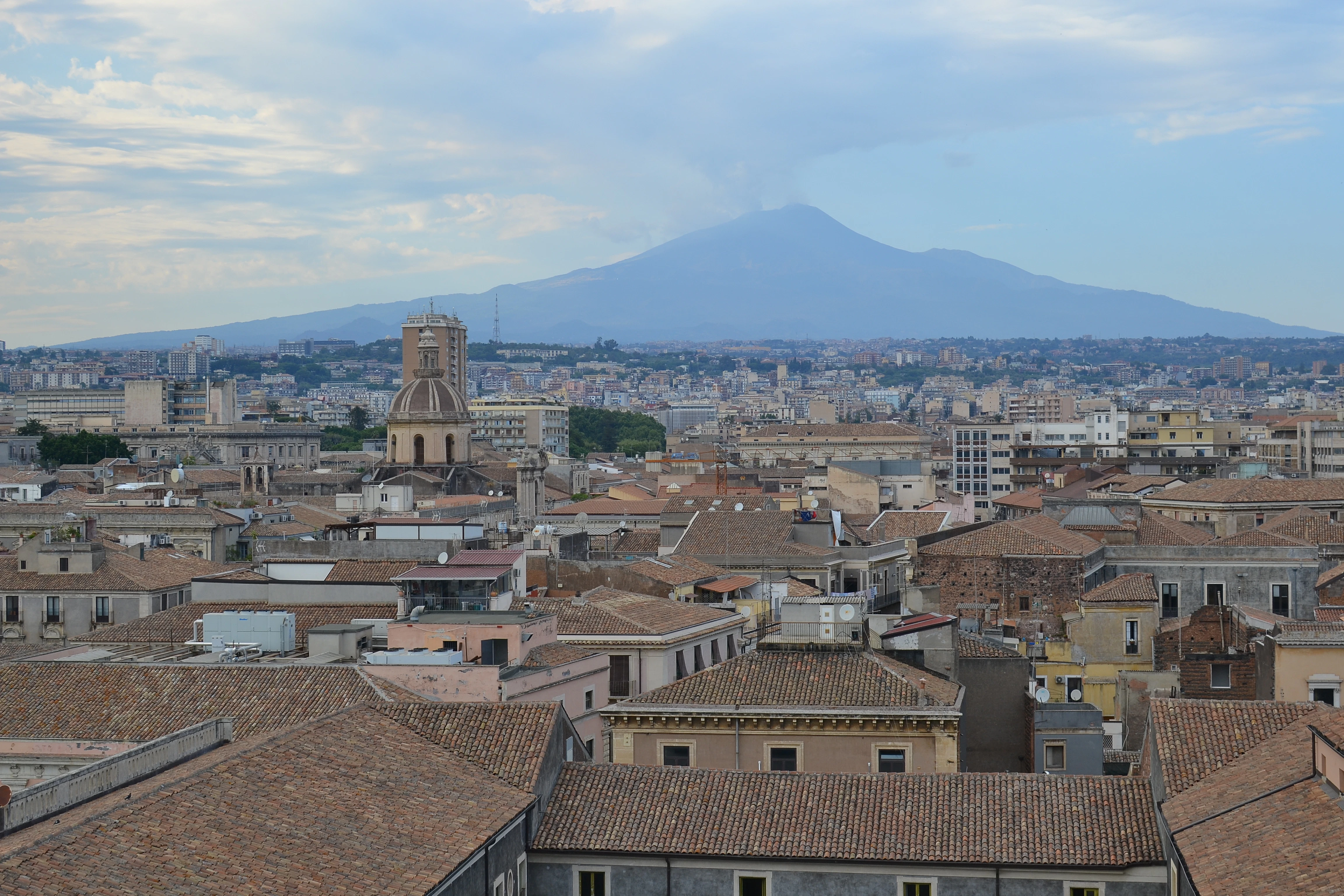 a city with a mountain in the background