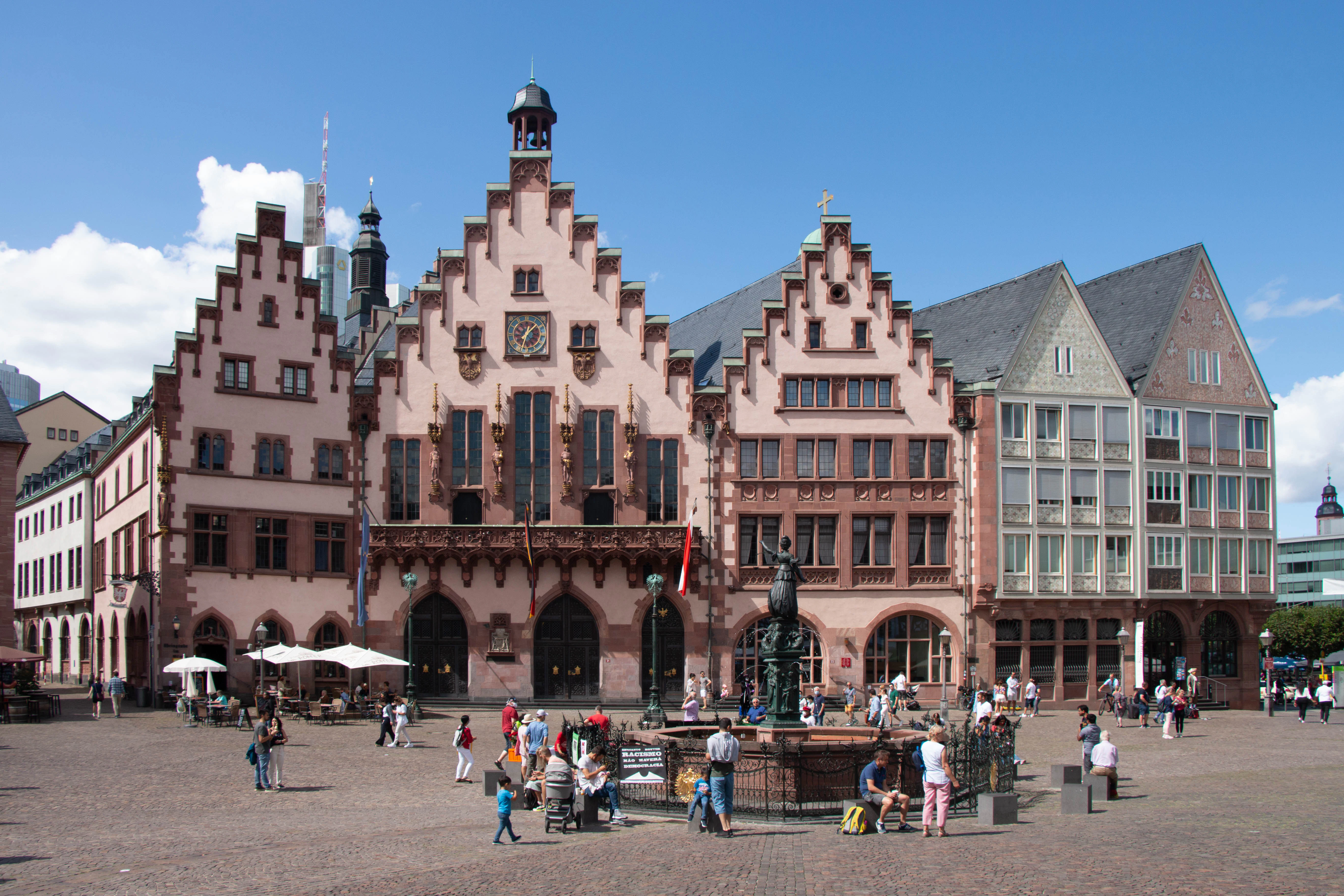 a large building with a fountain in front of it