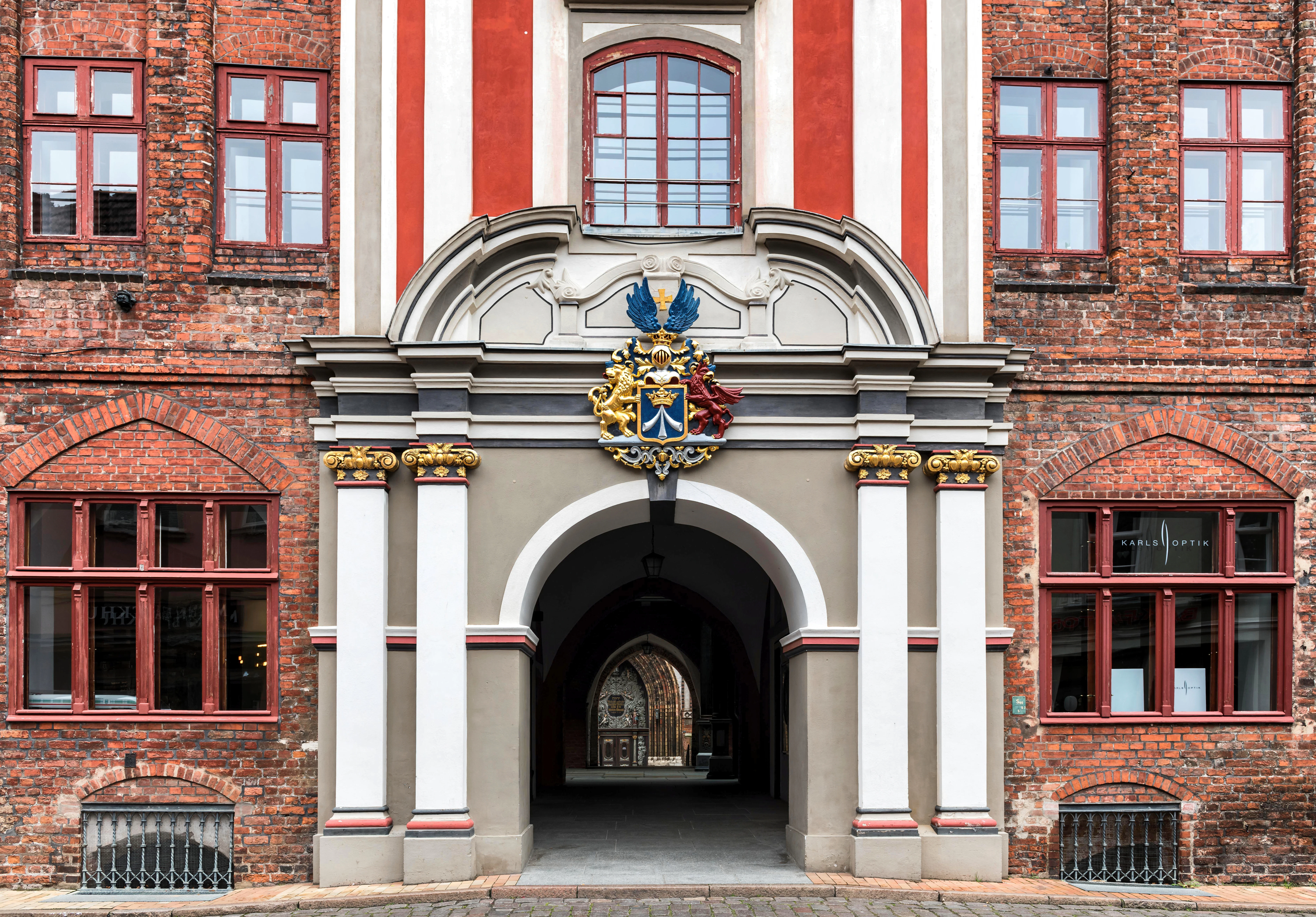 Ornate arched entryway of a historic brick building