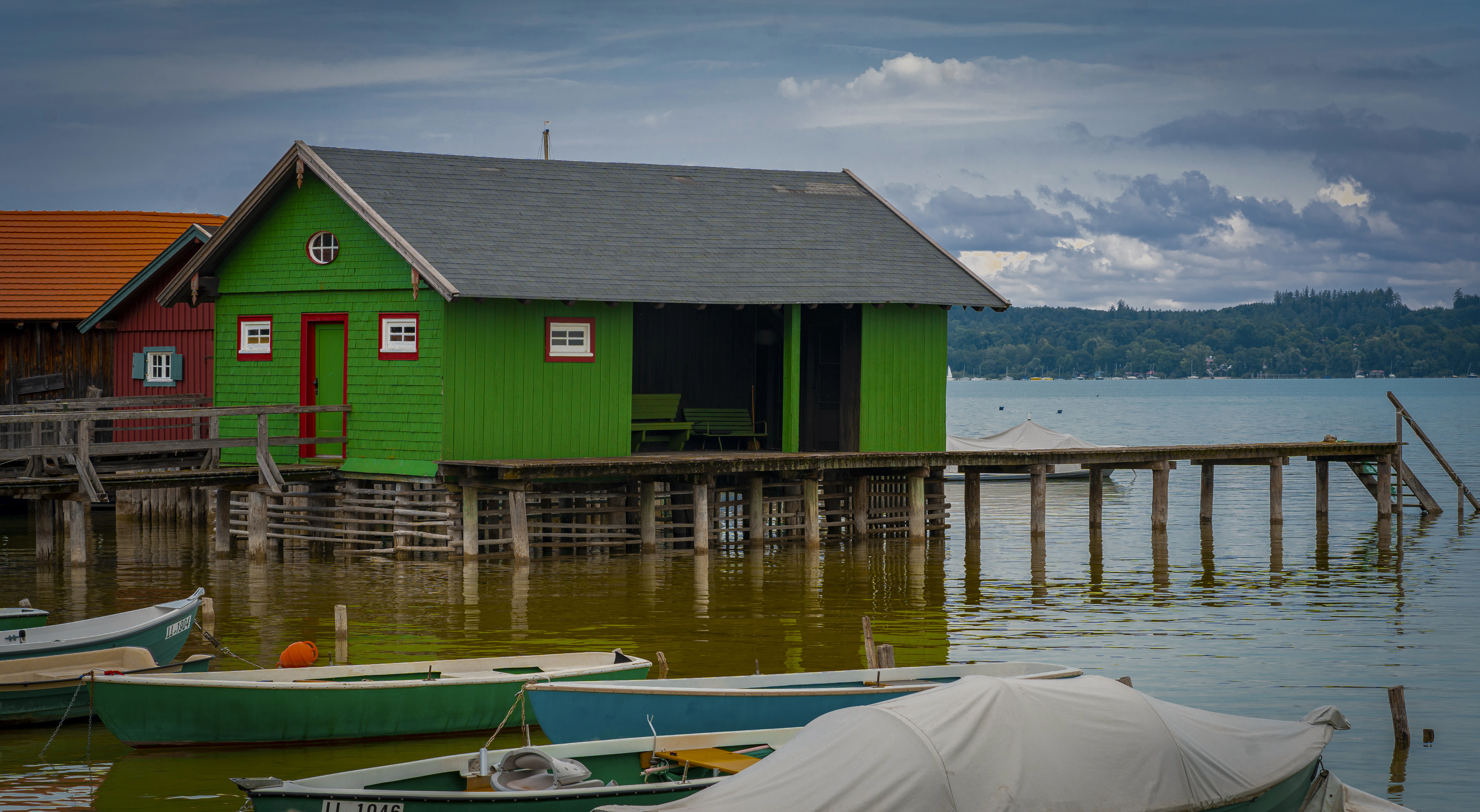 A group of boats that are sitting in the water