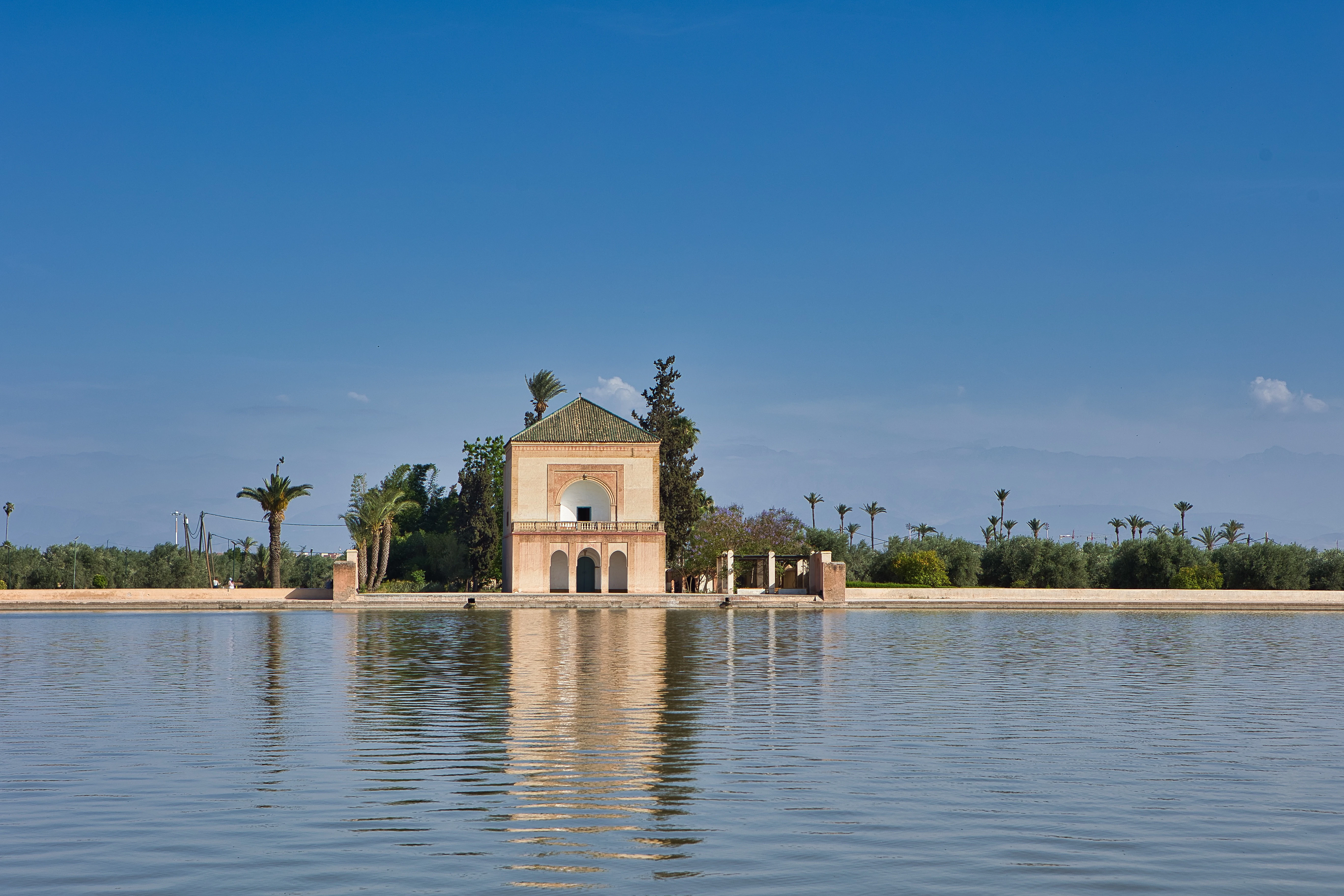 A large body of water with a building in the middle of it