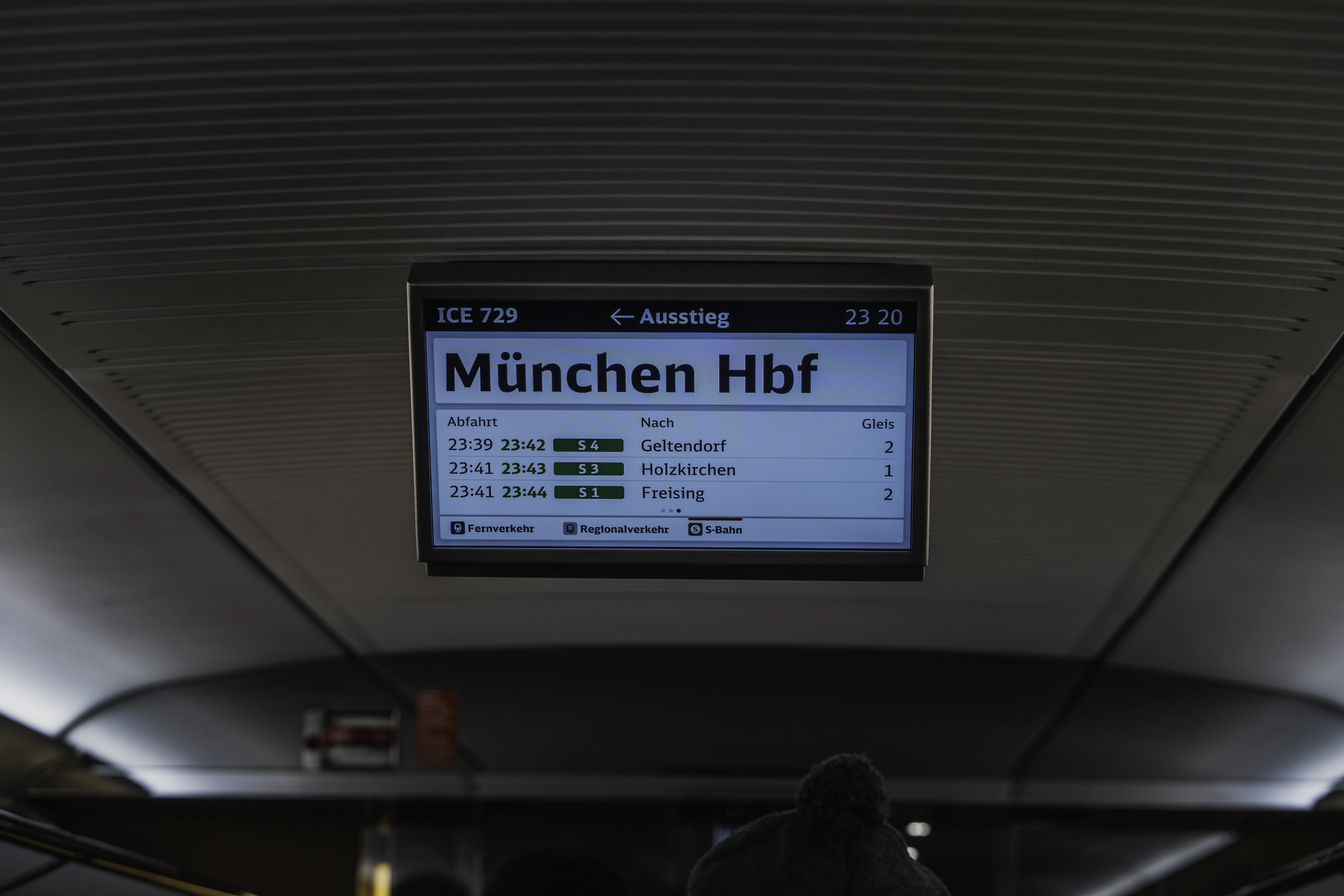 a sign that is on the ceiling of a train