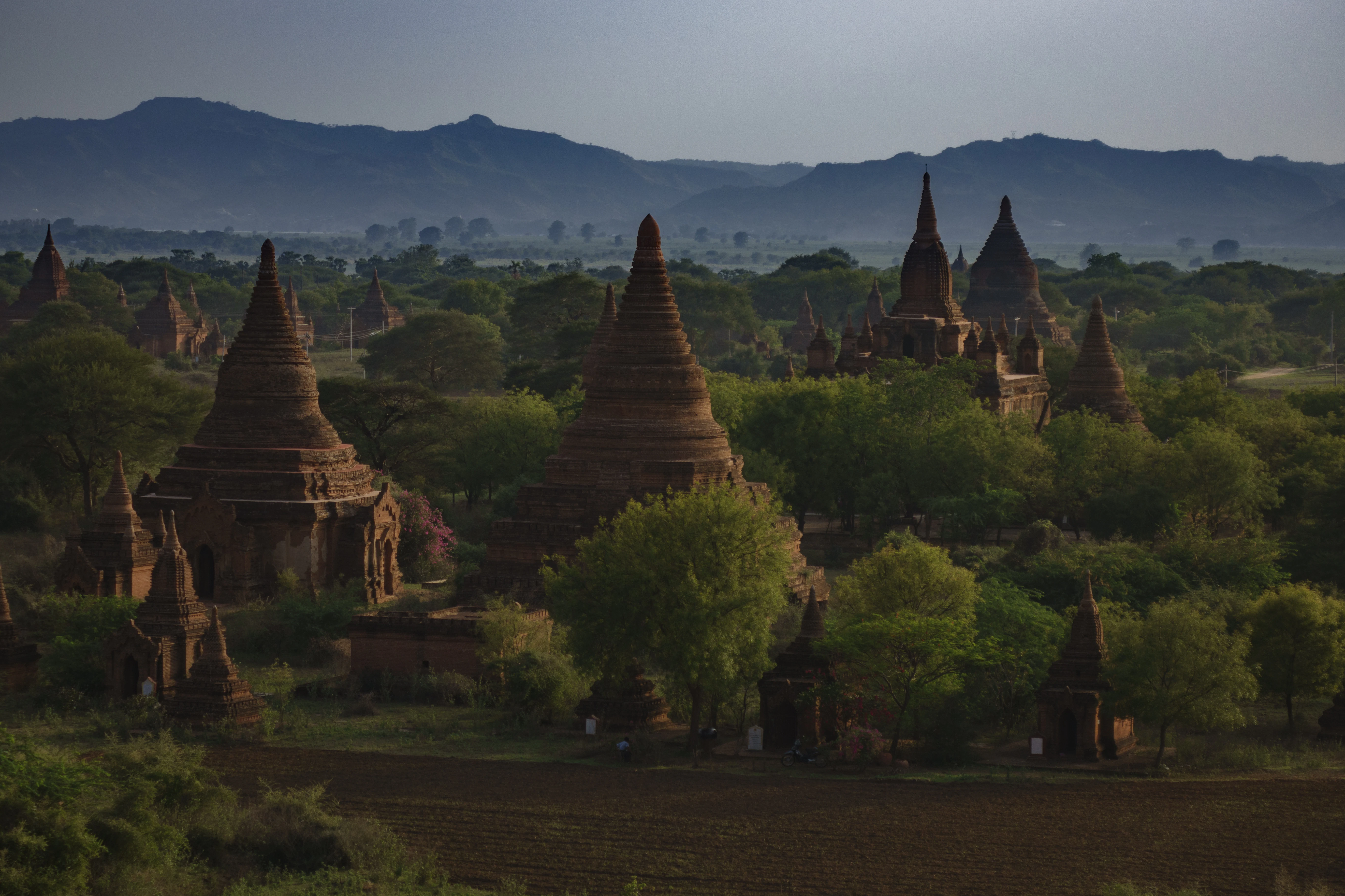 a large group of temples in the middle of a field