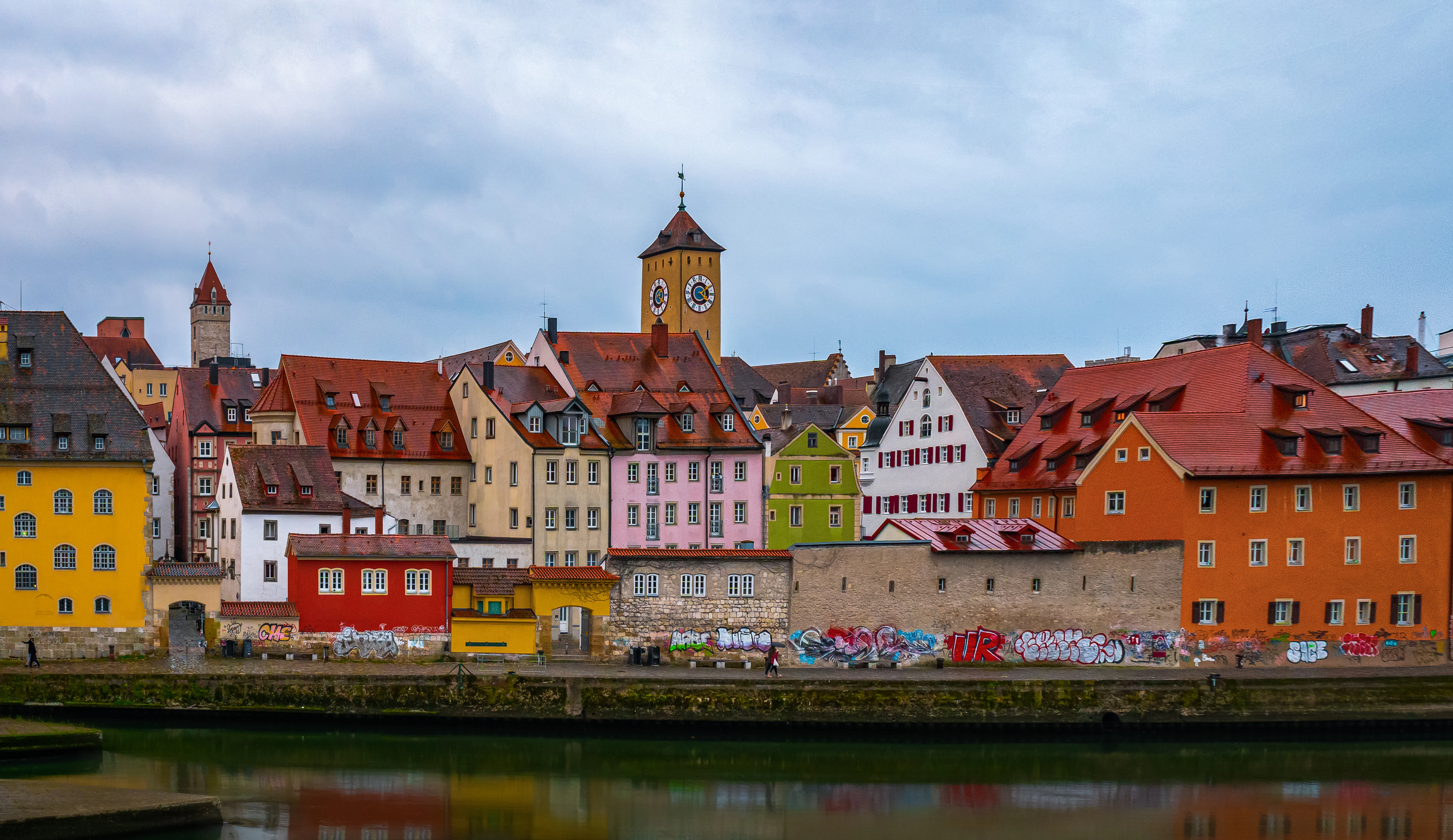 A group of buildings that are next to a body of water