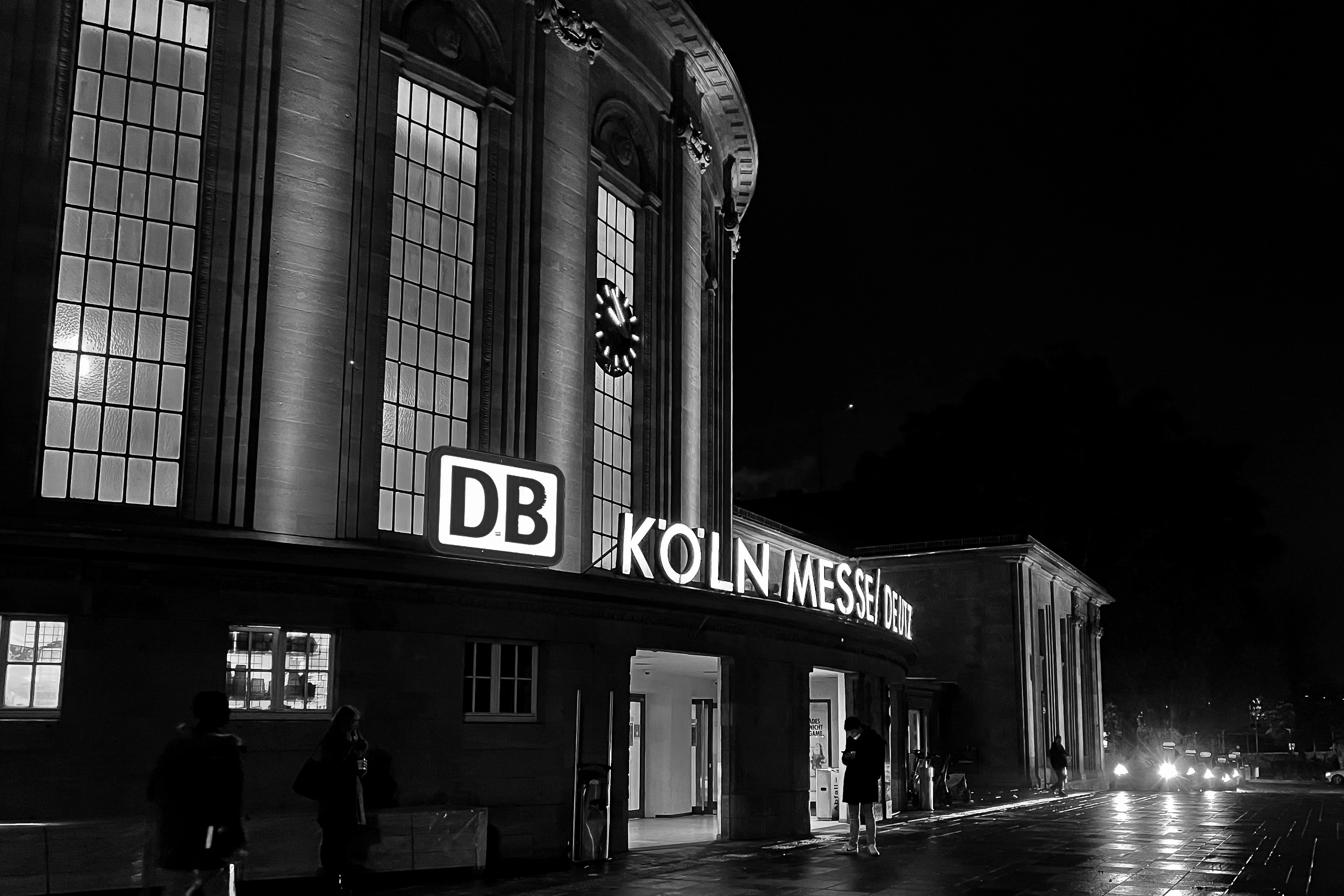 a black and white photo of a building at night