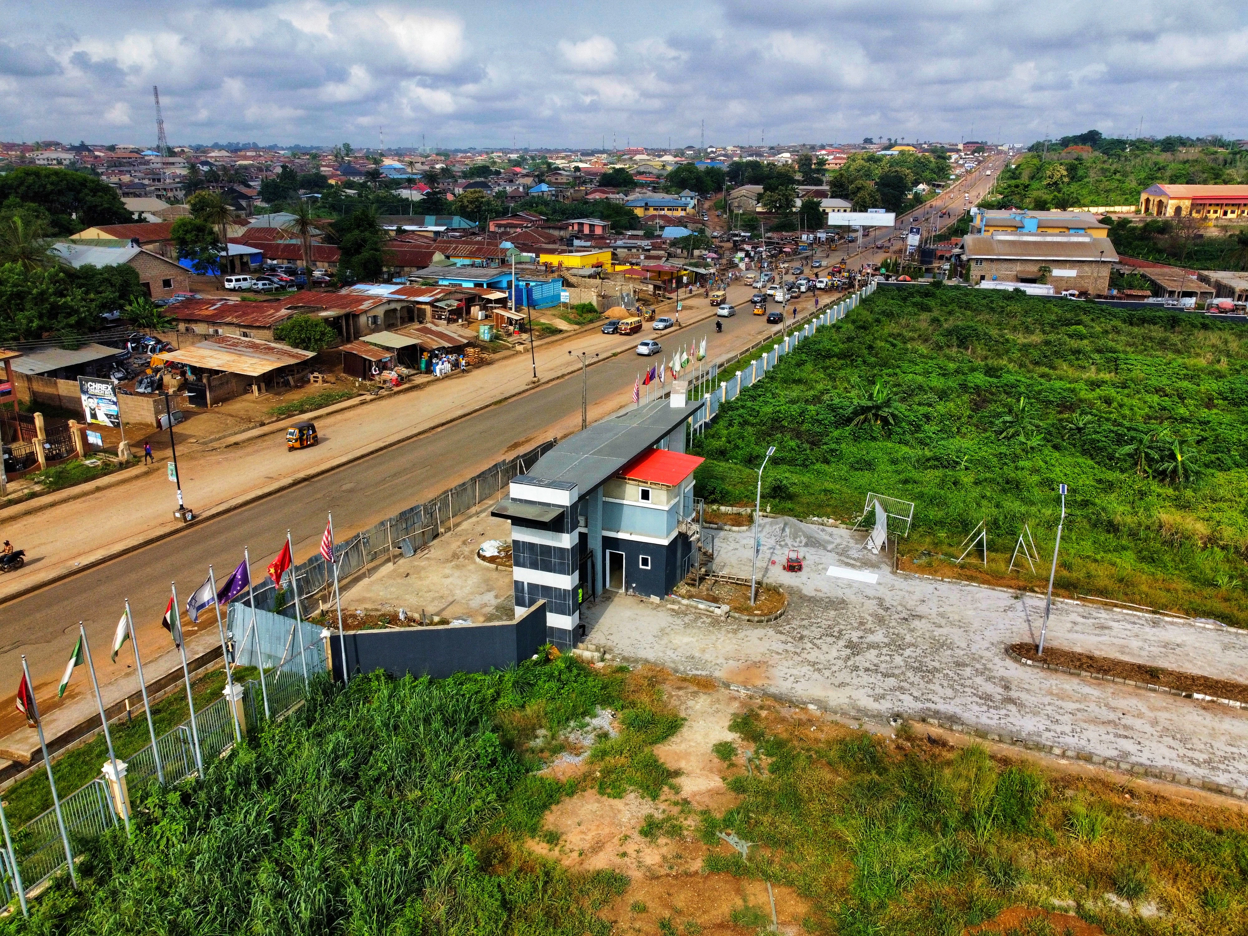 an aerial view of a small town with a bridge