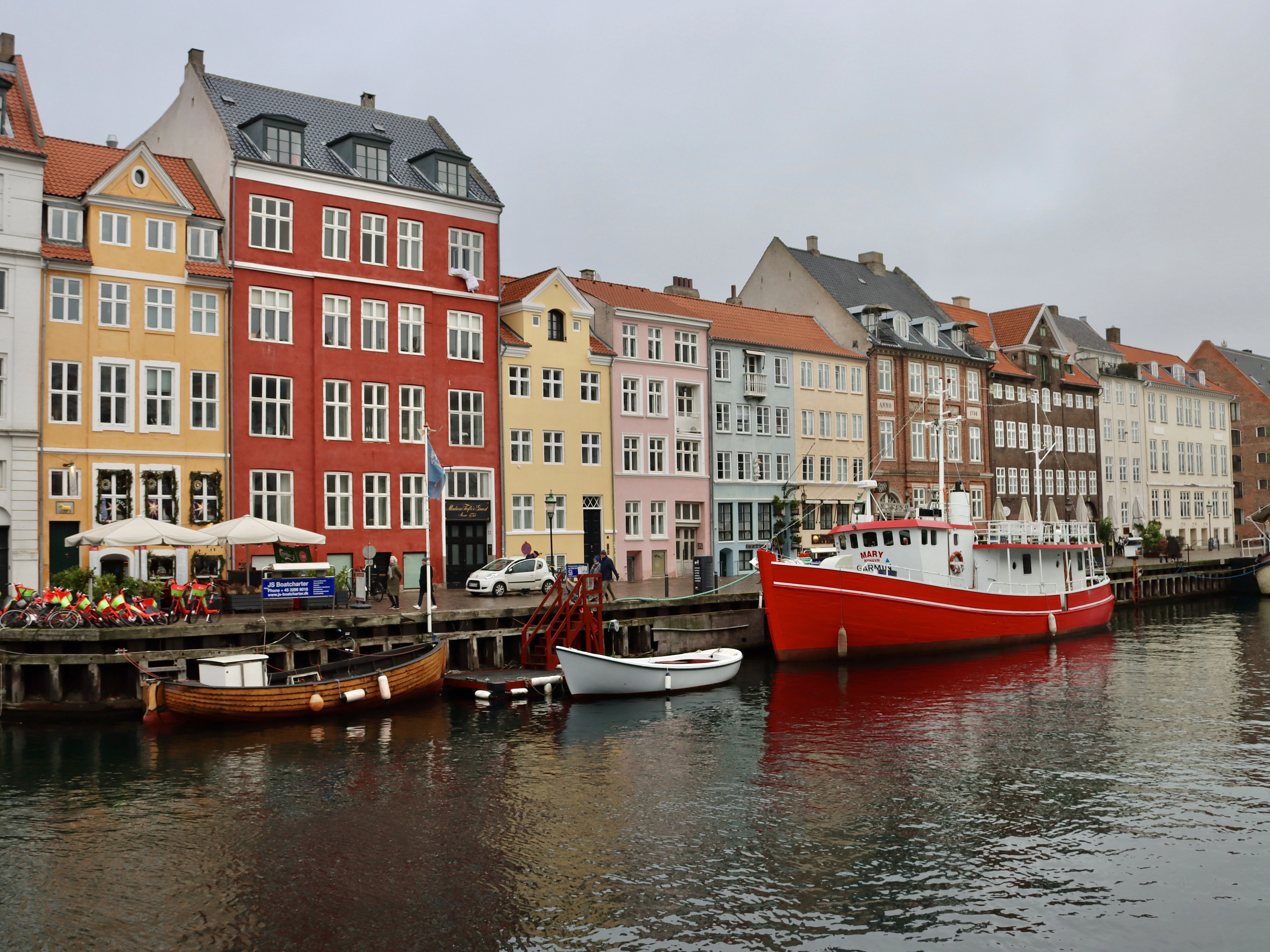 a row of buildings next to a body of water