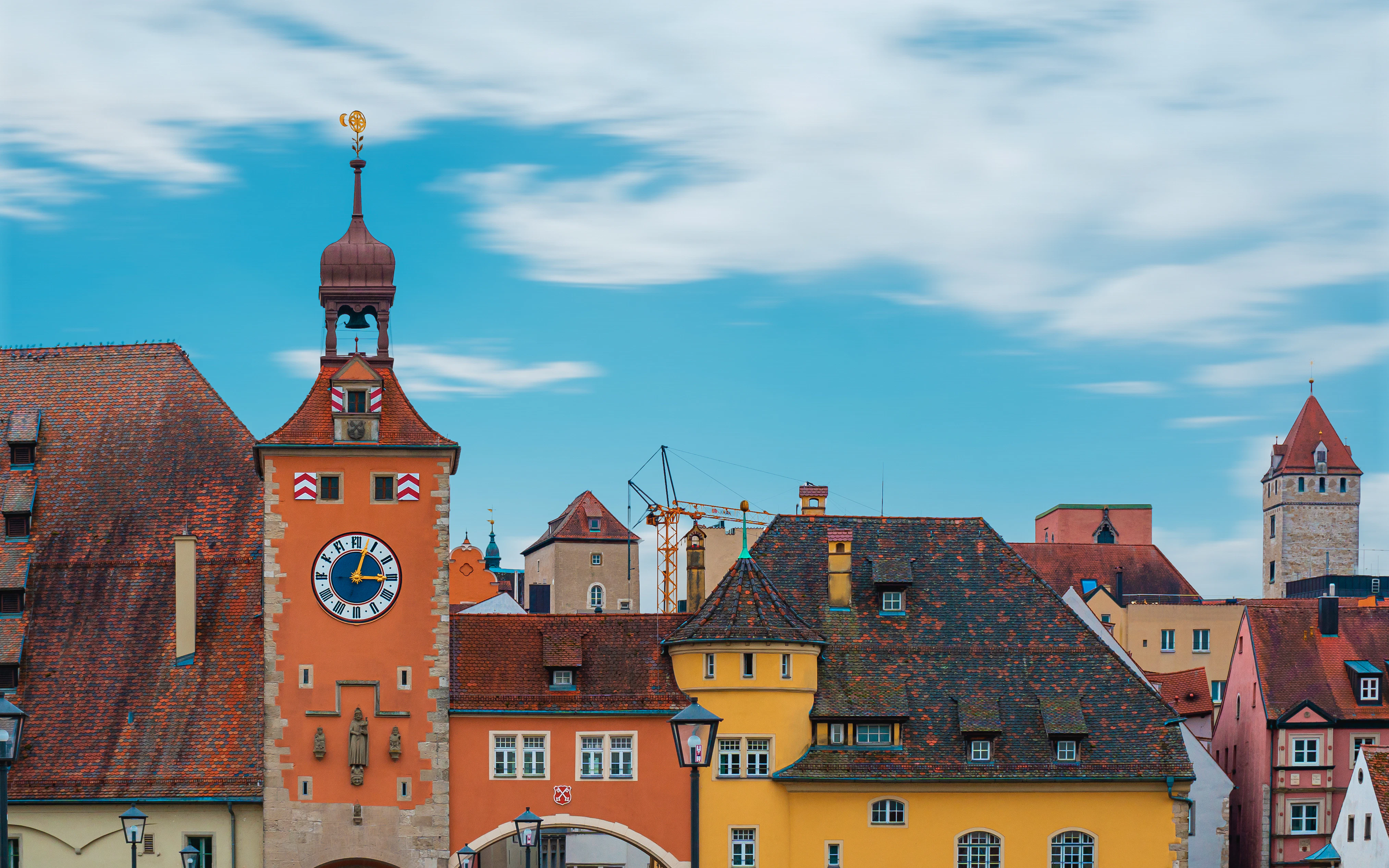 A clock tower in the middle of a city