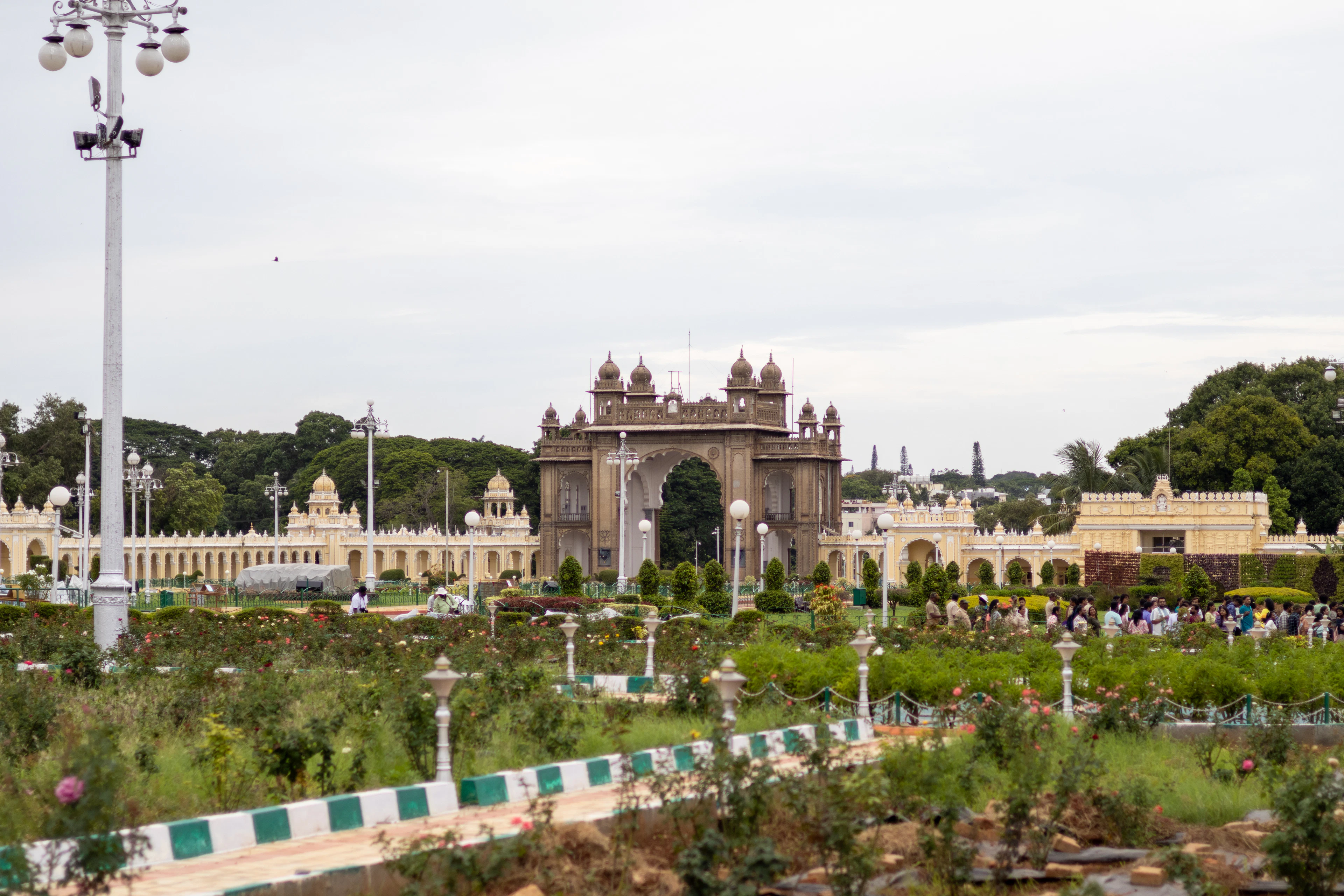 A view of a park with a clock tower in the background