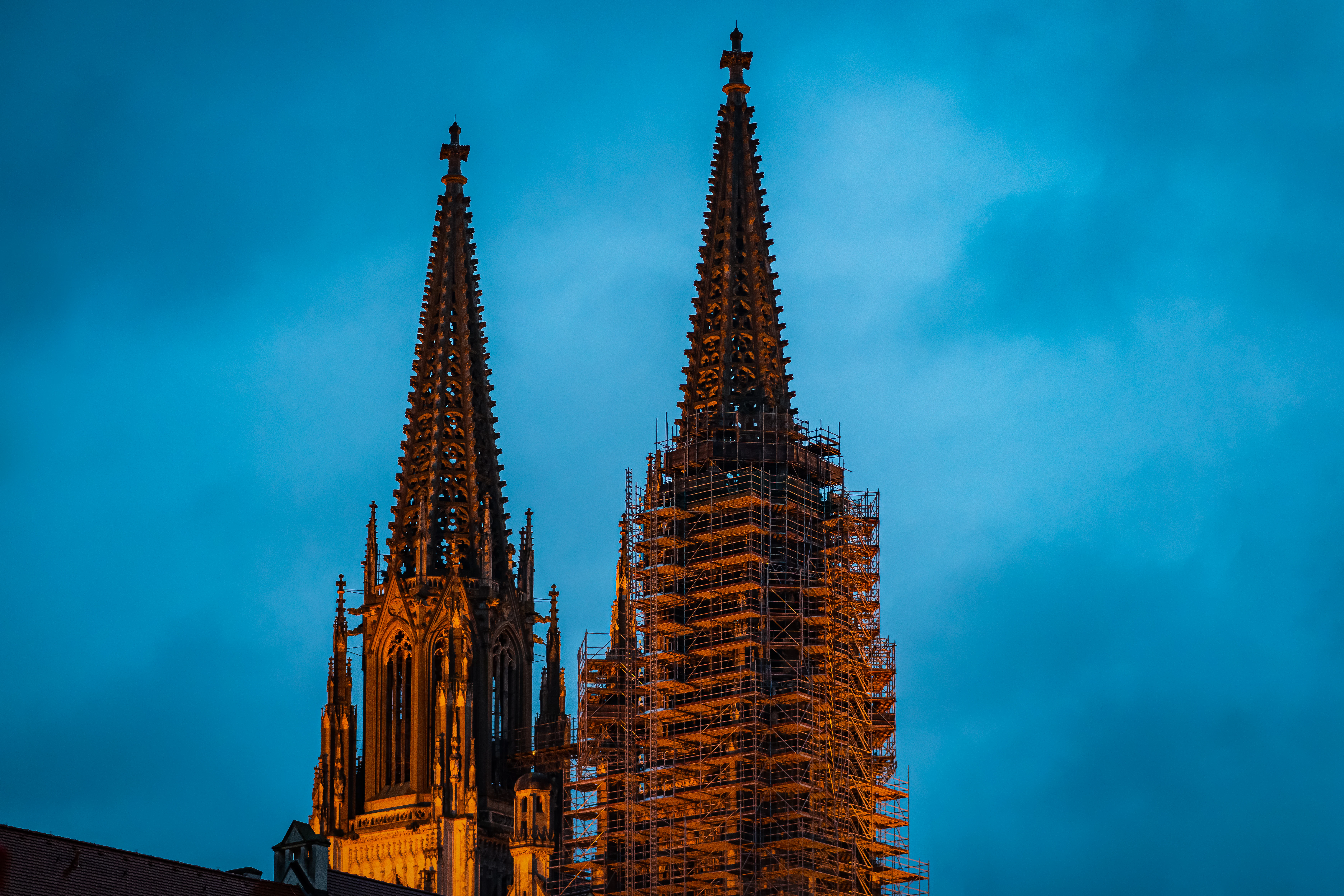 A large cathedral with a clock on it's side